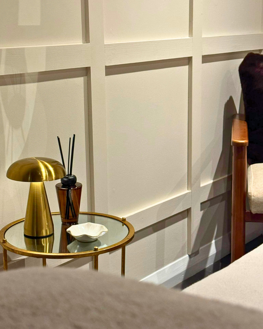 Salon renovation — styled corner with paneled walls